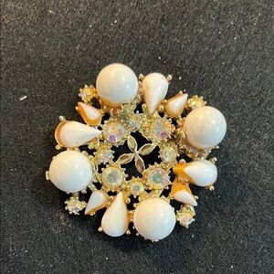 Gold Tone and White Brooch